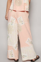 Elevate your fashion game with our Embroidered Drawstring Lace Patch Wide Leg Pants. Delicate lace patches add an elegant touch while the drawstring waist provides a perfect fit. With wide legs for a flowy look, these pants offer both style and comfort for any occasion.