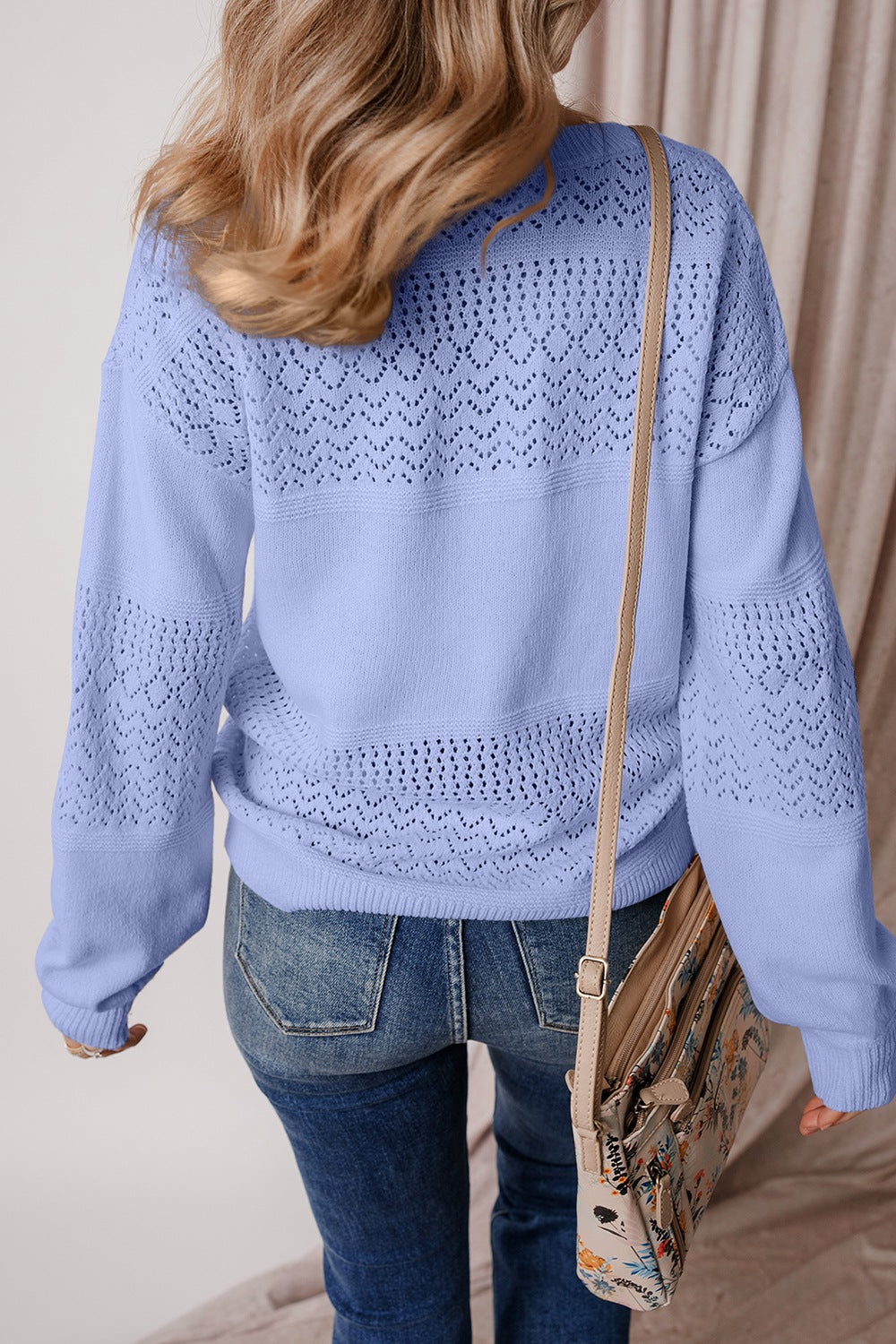 Crafted from a soft, breathable fabric, the V-Neck Sweater features openwork details and long sleeves for a stylish and comfortable look. Can be layered or worn alone for both function and fashion.