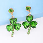 Experience a touch of sophistication with our stunning Lucky Clover Dangle earrings. Skillfully made with glittering peridot color & rhinestones and a lavish alloy, these earrings exude a sense of elegance and charm. Let the lucky clover design bring you good fortune and take your style to elevated levels.