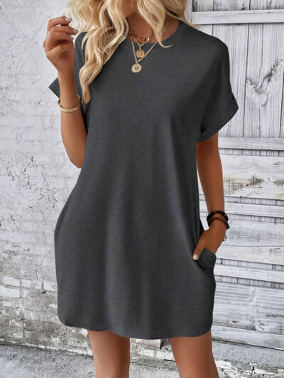 Indulge in luxury with our Mini Tee Dress. Crafted with a round neck, short sleeves, and convenient pockets, this dress effortlessly elevates your look. Perfect for running errands or attending a chic event, it's a versatile addition to your wardrobe. Comfort and style, all in one!