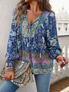 Cruisin Essentials Bohemian Tie Neck Lantern Sleeve Blouse! The bohemian-inspired design, tie neck, and lantern sleeves add effortless elegance to any outfit. Perfect for any occasion, embrace the trending bohemian look.