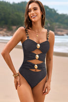 Elevate your swimwear options with our Cutout Ruched Sweetheart Neck One Piece! The refined sweetheart neckline and strategic cutouts highlight your figure, while the ruched embellishments bring a hint of sophistication. Take on your next beach day with assurance thanks to this fashionable and cozy swimwear.