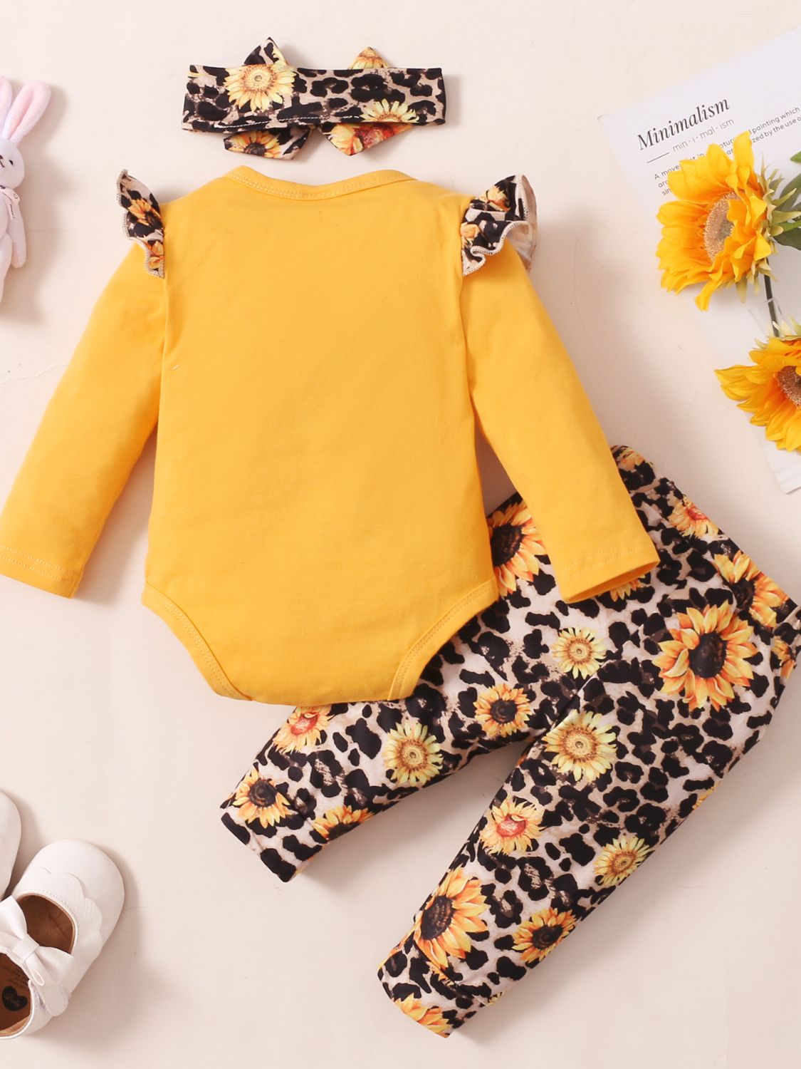 Cruisin Essentials set features a headband, bodysuit with a letter design, and leopard print pants. Perfect for your little fashionista with soft, durable materials. Add it to your child's wardrobe for style and comfort. Includes Bow, Tied.