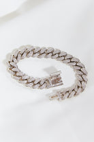 This bracelet features the classic curb chain design, making it a must-have for any jewelry collection. It perfectly complements other bracelets, adding a touch of bold sophistication to any outfit.