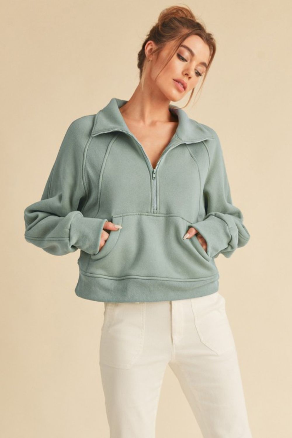 Our Limited Edition Half Zip Raglan Sleeve Sweatshirt is the perfect addition to your wardrobe. Made with high-quality fabric, it offers long-lasting comfort and style. The kangaroo pocket adds convenience, while the raglan sleeves allow for full range of motion. Whether worn for everyday use or during a workout, this sweatshirt is sure to become a favorite.