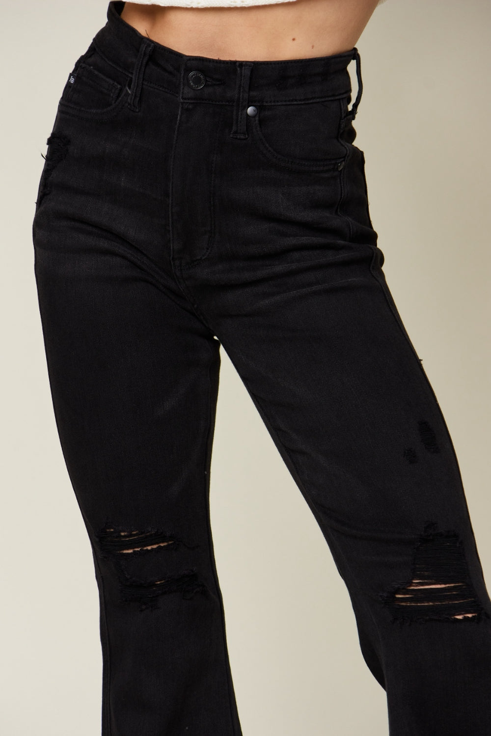 Expertly crafted with a high waist and distressed flare design, these Blue jeans provide a flattering fit while making a stylish statement. Made from high-quality materials, these jeans offer both comfort and durability. Elevate your denim game with these must-have jeans.