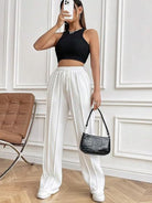 Upgrade your wardrobe with our expertly crafted Wide Leg Pants. Featuring a drawstring waistband and spacious pockets, these pants offer both style and practicality. Enjoy ultimate comfort and convenience without sacrificing on fashion. A must-have for any fashion-forward individual.