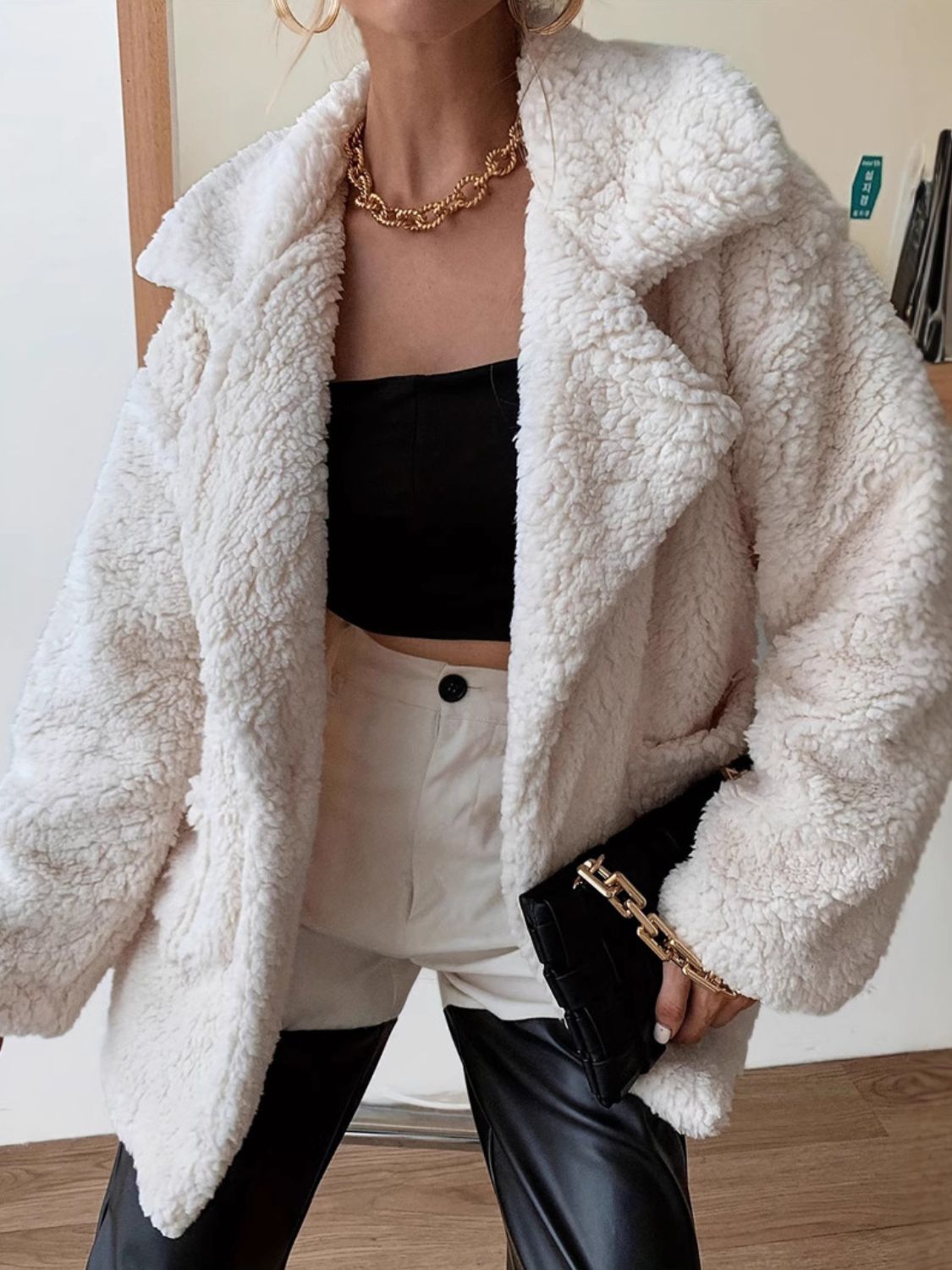 This Fuzzy Open Front Long Sleeve Coat is a must-have for colder weather. With its soft and fuzzy texture, it provides excellent warmth and comfort. Its open front design allows for easy layering, making it a versatile addition to any wardrobe. Stay cozy and stylish with this coat.