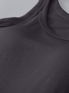 With its seamless design and high-quality materials, this tank offers both comfort and support for all your daily activities. Whether you're lounging at home or working out at the gym, this tank is perfect for any occasion. Look and feel your best with the built-in bra and stay comfortable all day long.