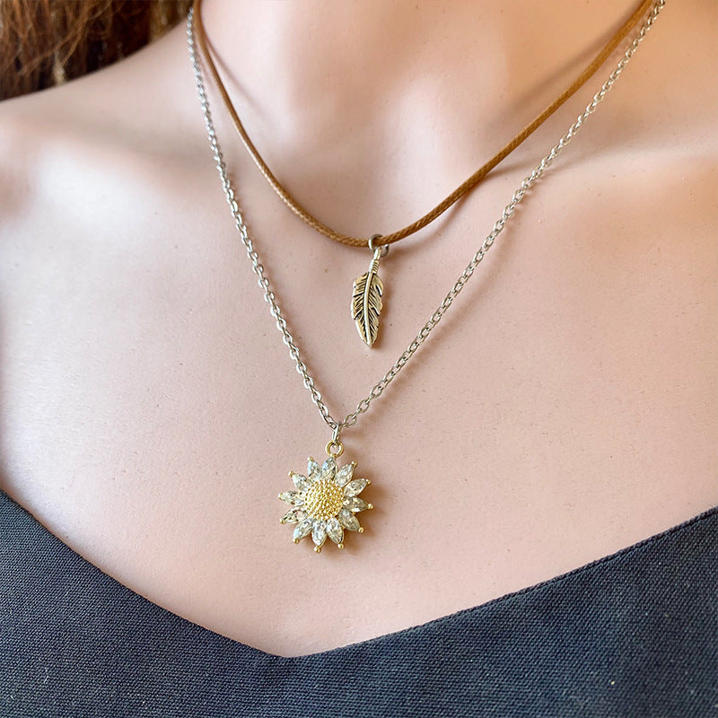 This sunflower pendant necklace by Trendsi Trends is a must-have accessory for any fashion-forward individual. Made with high-quality materials, this necklace features a stunning sunflower pendant that adds a touch of elegance to any outfit. Perfect for everyday wear or special occasions, this necklace is a versatile and timeless piece.