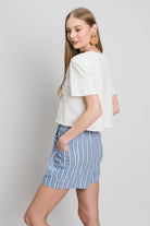 Elevate your summer wardrobe with Cotton Bleu by Cruisin Organics, Yarn Dye Striped Shorts. Crafted with yarn-dyed fabric, these shorts offer a durable and high-quality finish. The classic striped pattern adds a timeless touch to the design, making it a versatile and stylish option. Pair with a simple tee for a relaxed and effortless look.