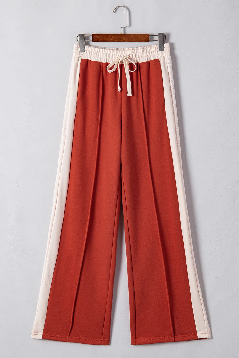 Elevate your wardrobe with our Contrast Wide Leg Pants. Designed with a wide leg and adjustable drawstring waist, these two-tone pants offer both style and comfort. Crafted from high-quality materials, they provide a flattering fit for all body types. Perfect for any occasion, these pants are a must-have addition to your collection.