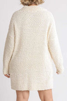 Experience effortless elegance with our Umgee Boucle Sweater Dress. Featuring a full-size fit and luxurious long sleeves, this dress offers both comfort and style. The unique bounce fabric adds a touch of sophistication to your wardrobe. Available in plus size for a truly perfect and flattering fit.