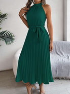 A perfect blend of elegance and timelessness, our Grecian Neck Tie Waist Pleated Dress exudes sophistication and luxury. The design boasts a Grecian-inspired neckline, complete with a chic neck tie and a flattering tied waist. The addition of a pleated skirt infuses a touch of femininity, truly making this dress a must-have for any special occasion. Elevate your wardrobe with this exquisite piece, exclusively available here.