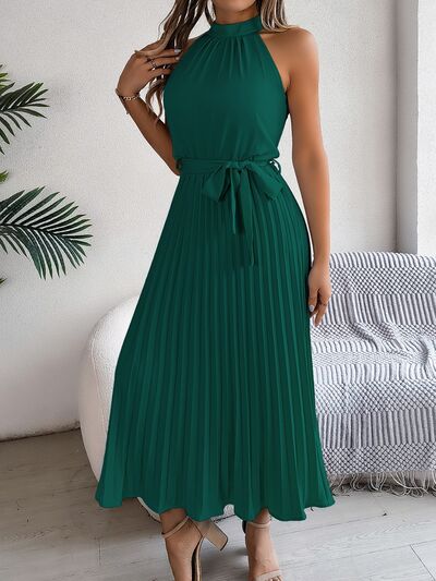 A perfect blend of elegance and timelessness, our Grecian Neck Tie Waist Pleated Dress exudes sophistication and luxury. The design boasts a Grecian-inspired neckline, complete with a chic neck tie and a flattering tied waist. The addition of a pleated skirt infuses a touch of femininity, truly making this dress a must-have for any special occasion. Elevate your wardrobe with this exquisite piece, exclusively available here.