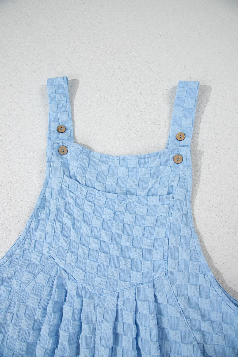 Introducing our Checkered Pocketed Wide Leg Overalls - a must-have for the fashion-forward and practical individual. These overalls feature a stylish checkered design and spacious pockets, perfect for both style and functionality. Made with durable and comfortable materials, elevate your outfit with these premium overalls.