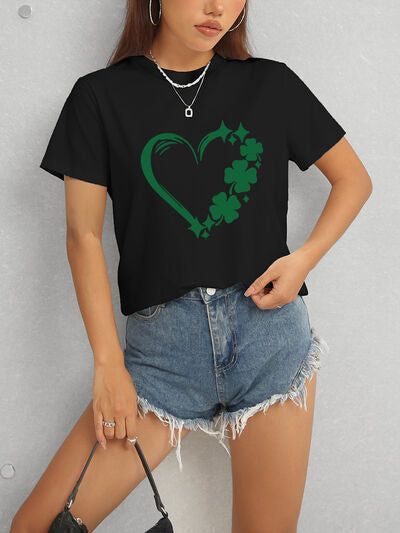 Express your love for luck with our Heart Lucky Clover T-Shirt! Made with a round neck and short sleeves, this soft and stylish t-shirt showcases a heart and clover design, perfect for adding a touch of luck to any outfit. Wear it casually or dress it up for a fun and charming look!