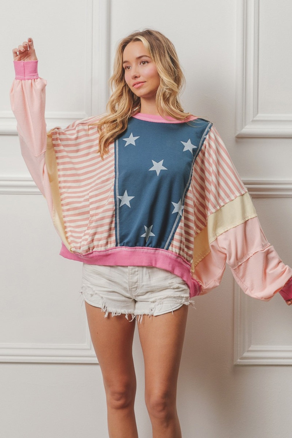 Unleash your boldness with Cruisin Essentials' Stars and Stripes Round Neck Long Sleeve Top. Perfect for anyone who loves taking risks, this top is a must-have for those seeking adventure and challenge. Show off your daring spirit with this one-of-a-kind top!