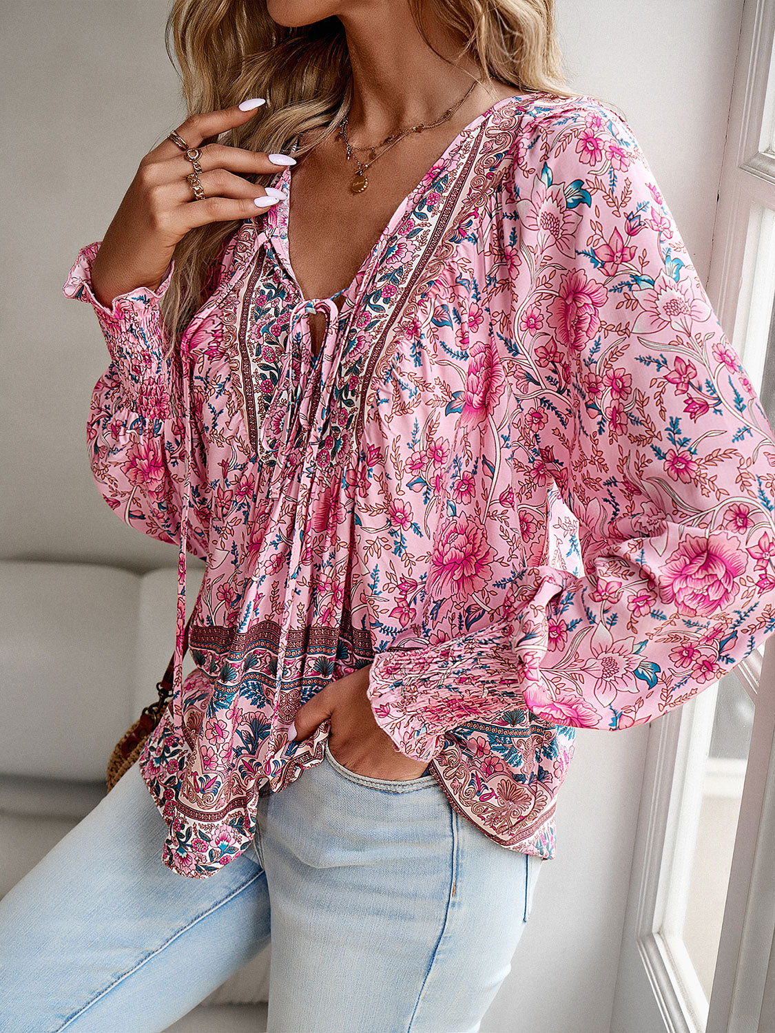 Introducing our must-have Bohemian Tie Neck Lantern Sleeve Blouse from Cruisin Essentials. Elevate your style with its bohemian-inspired design featuring a tie neck and lantern sleeves for a touch of effortless elegance. Perfect for any occasion, embrace the trend and elevate your wardrobe with this essential piece.