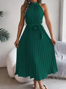 A perfect blend of elegance and timelessness, our Grecian Neck Tie Waist Pleated Dress exudes sophistication and luxury. The design boasts a Grecian-inspired neckline, complete with a chic neck tie and a flattering tied waist. The addition of a pleated skirt infuses a touch of femininity, truly making this dress a must-have for any special occasion. Elevate your wardrobe with this exquisite piece, exclusively available here.