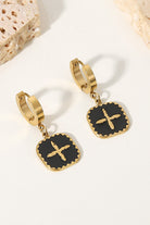 Elevate any outfit with our stunning cross-square drop earrings! Featuring a unique square drop design and a sleek cross detail in black and gold, these earrings make a statement and add a touch of elegance to any look. Make a bold contrast and stand out with these eye-catching accessories.