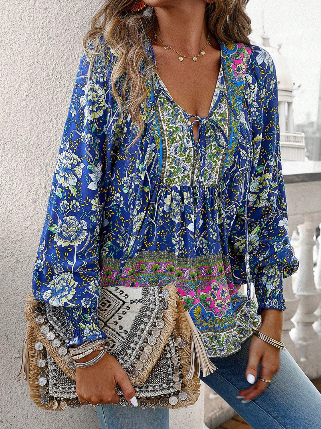 Introducing our must-have Bohemian Tie Neck Lantern Sleeve Blouse from Cruisin Essentials. Elevate your style with its bohemian-inspired design featuring a tie neck and lantern sleeves for a touch of effortless elegance. Perfect for any occasion, embrace the trend and elevate your wardrobe with this essential piece.