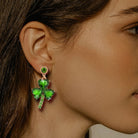 Upgrade your style with these Lucky Clover Dangle earrings. Made with peridot color & rhinestones and a lavish alloy, they exude elegance and charm. Let the lucky clover design bring you good fortune.