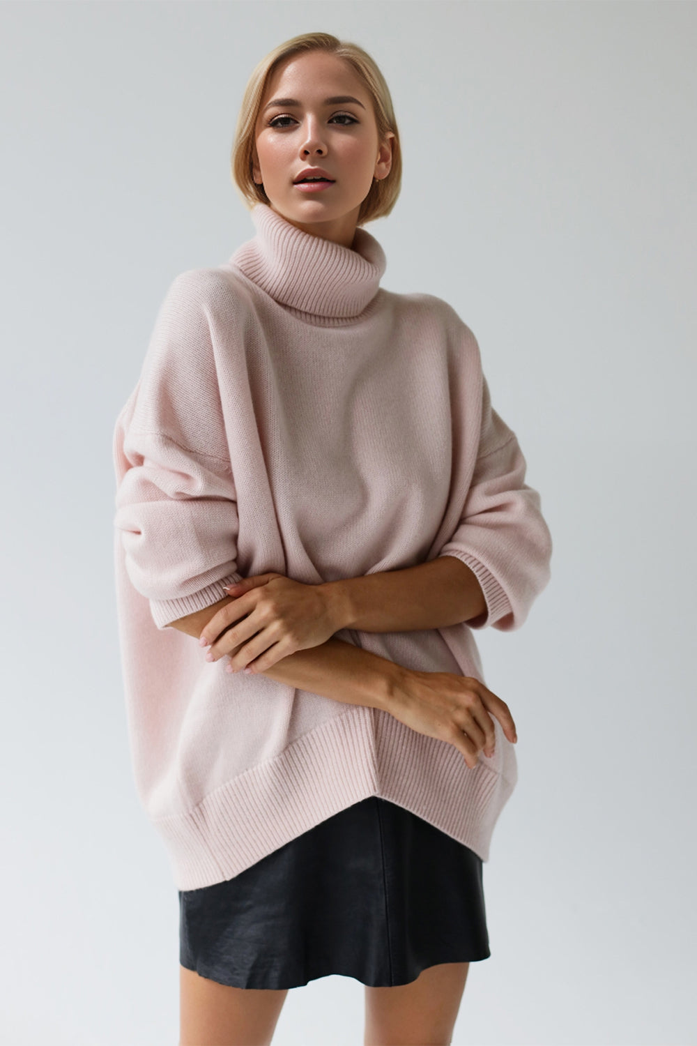 Introducing Trendsi Trends Dropped Shoulder Turtleneck Sweater. Upgrade your winter wardrobe with this modern design, featuring a comfortable turtleneck and trendy dropped shoulder fit. Keep cozy and stylish with long sleeves for added coverage.