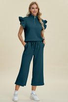 Achieve the perfect blend of fashion and comfort with the Cruisin Essentials Full Size Texture Ruffle Short Sleeve Top and Wide Leg Khaki Pants Set. Designed by experts, this set features beautiful ruffle detailing and a stretchy fabric that ensures a flattering fit. Elevate your wardrobe and make a statement with this versatile set.