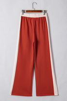 Elevate your wardrobe with our Drawstring Contrast Wide Leg Pants. These stylish and comfortable pants feature a two-tone design, adjustable drawstring waist, and high-quality materials. Their wide leg fit flatters all body types, making them perfect for any occasion. Upgrade your style game with these versatile and trendy pants.