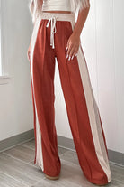 Upgrade your wardrobe with these stylish and comfortable Drawstring Contrast Wide Leg Pants. Made with high-quality materials, the two-tone design and adjustable drawstring waist provide a flattering fit for all body types. Perfect for any occasion, these pants are a versatile and trendy addition to any outfit.