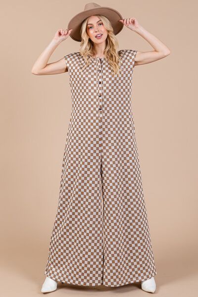 Unleash your bold and adventurous side with our Checkered Half Button Cap Sleeve Jumpsuit! This stylish jumpsuit combines checkered print and a daring half button design for a unique look. Stand out from the crowd and make a statement with this jumpsuit!