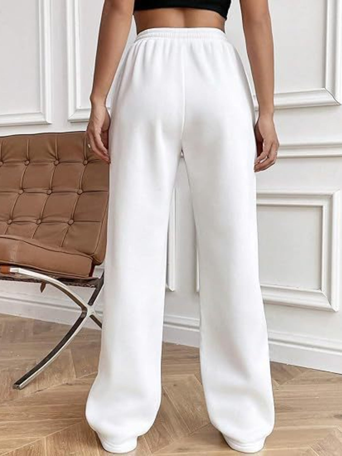 Elevate your style and comfort with our expertly crafted Wide Leg Pants. The drawstring waistband and spacious pockets provide both practicality and sleek design. Perfect for any occasion, these pants are a must-have addition to your wardrobe.