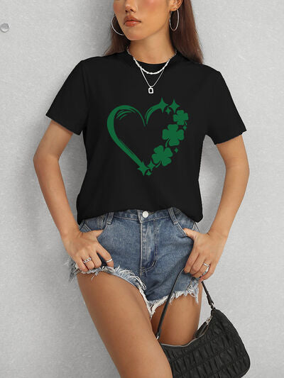 Black and Green Tee.Express your love for luck with our Heart Lucky Clover T-Shirt! Made with a round neck and short sleeves, this soft and stylish t-shirt showcases a heart and clover design, perfect for adding a touch of luck to any outfit. Wear it casually or dress it up for a fun and charming look!