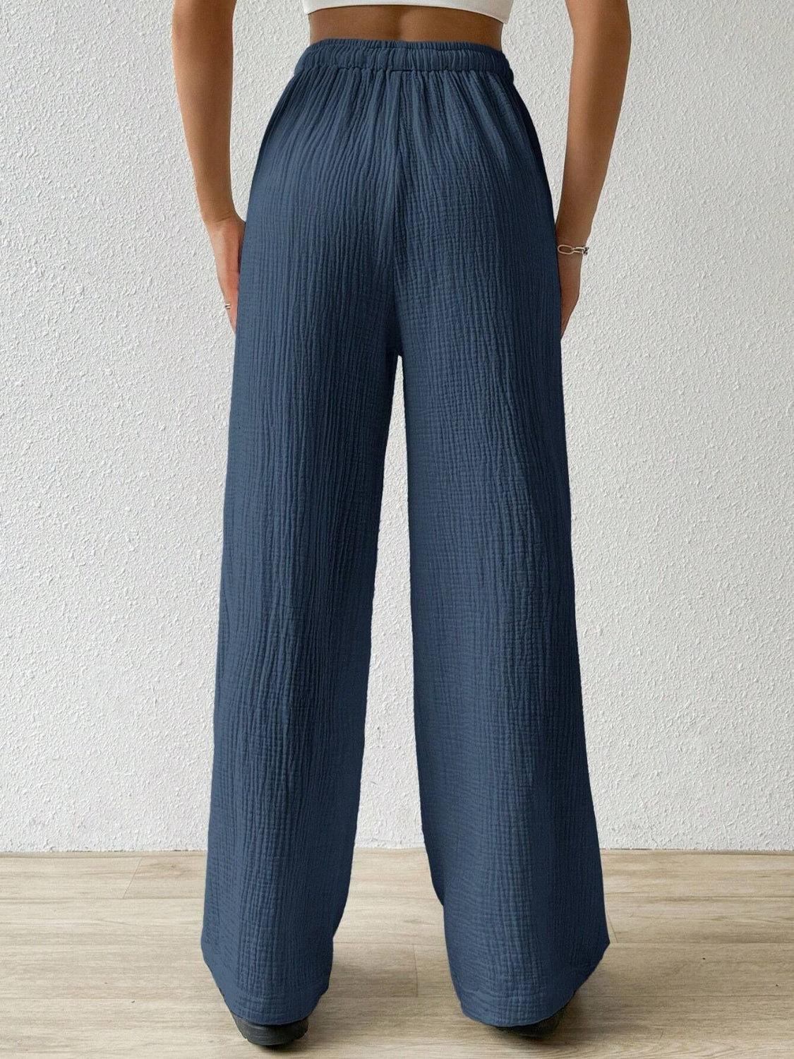 Dark Blue Drawstring Wide Leg Pants. The drawstring waist allows for a customizable fit, while the wide leg design provides freedom of movement.