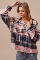 Be bold and fashionable in the Drop Shoulder Plaid Hoodie with Drawstring! The trendy plaid design adds an edgy touch, while the relaxed fit provided by the drop shoulders allows for comfort and style. Stay warm and customize the hoodie with drawstring detailing. Make a statement on cooler days with this functional yet trendy piece.