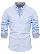 The Iur Men's Light Blue Button Down Collared Neck Shirt has two-tone cuffs and a collar. Crafted from non-iron 2-ply cotton pinpoint oxford, this dress shirt offers a timeless look with a modern twist thanks to the contrast trim. Reinforced with longer tails and break-resistant buttons for ultimate durability.