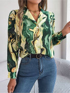 Elevate your wardrobe with our luxurious Trendsi Trends Marble Printed shirt. Made with high-quality materials, this collared button-up exudes elegance and exclusivity. Available in multiple vibrant colors, it's the perfect statement piece for any season. Indulge in style and sophistication with our must-have blouse.